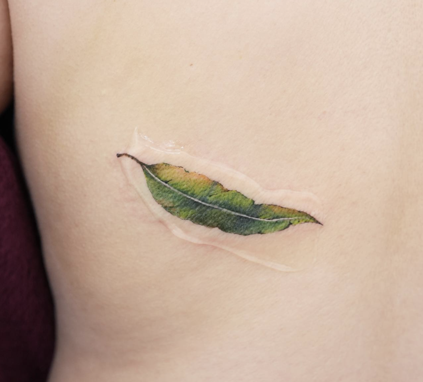 micro realism style tattoo by Tina Choi